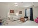 Cozy bedroom featuring a comfortable bed, neutral carpet, and ample natural light at 16002 E 111Th Cir, Commerce City, CO 80022