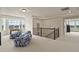 Spacious bonus room with bright, natural light, comfortable seating and a foosball table at 16002 E 111Th Cir, Commerce City, CO 80022