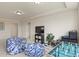 Large bonus room with comfortable beanbag seating and a foosball table for entertainment at 16002 E 111Th Cir, Commerce City, CO 80022