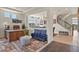 Bright and airy living room featuring modern decor, hardwood floors, and seamless open-concept design at 16002 E 111Th Cir, Commerce City, CO 80022