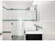 Modern bathroom featuring a stand-up shower and a vessel sink on a dark vanity at 2211 Lamar St, Edgewater, CO 80214