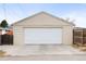 Exterior view of a detached one-car garage with a white door and a concrete driveway at 2211 Lamar St, Edgewater, CO 80214