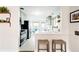 Bright, stylish kitchen featuring modern countertops, a breakfast bar, and stainless steel appliances at 2211 Lamar St, Edgewater, CO 80214