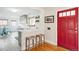 Modern kitchen featuring a breakfast bar and a convenient entryway to the dining area at 2211 Lamar St, Edgewater, CO 80214