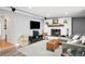Cozy living room with entertainment system, fireplace, and comfortable seating at 2211 Lamar St, Edgewater, CO 80214