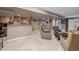 Basement rec room featuring wet bar, lounge seating, and carpet flooring at 10856 Parker Vista Ln, Parker, CO 80138