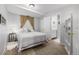 Bedroom with a patterned comforter, two closets, and an adjacent bathroom at 10856 Parker Vista Ln, Parker, CO 80138