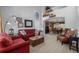 Spacious living room with high ceilings, natural light, comfortable seating, and an adjacent dining area at 10856 Parker Vista Ln, Parker, CO 80138