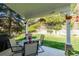 Cozy covered patio offers a tranquil view of the beautifully landscaped backyard at 10856 Parker Vista Ln, Parker, CO 80138