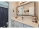 Stylish bathroom with a modern vanity, nautical decorations, and a shower/tub combo at 7998 E Vassar Dr, Denver, CO 80231