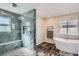 Luxurious bathroom featuring a glass shower, freestanding tub, and modern fixtures at 7998 E Vassar Dr, Denver, CO 80231