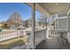 Inviting front porch with seating area, perfect for relaxing and enjoying the neighborhood views at 7998 E Vassar Dr, Denver, CO 80231