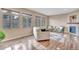 Comfortable living area with hardwood floors, large windows, and a cozy fireplace at 861 Circle, Palmer Lake, CO 80133