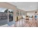 Expansive living area with large windows, hardwood floors, fireplace, and access to the deck at 861 Circle, Palmer Lake, CO 80133