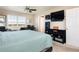 Bright bedroom with large windows, a ceiling fan, and an organized desk area at 3661 S Perth Cir # 6-101, Aurora, CO 80013