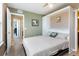 Comfortable bedroom with neutral tones and a Murphy bed and ensuite bath at 3661 S Perth Cir # 6-101, Aurora, CO 80013