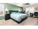 Bedroom with natural light, a ceiling fan, and green accent wall at 3661 S Perth Cir # 6-101, Aurora, CO 80013