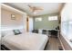 Cozy bedroom featuring a Murphy bed, desk area, and natural light at 3661 S Perth Cir # 6-101, Aurora, CO 80013