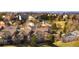 A view of townhomes with the Rocky Mountains in the background and beautifully maintained landscaping at 3661 S Perth Cir # 6-101, Aurora, CO 80013