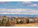 A neighborhood featuring cozy homes against a backdrop of the snow-capped Rocky Mountain range at 3661 S Perth Cir # 6-101, Aurora, CO 80013