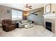 Cozy living room featuring a fireplace, comfortable seating, and natural light at 3661 S Perth Cir # 6-101, Aurora, CO 80013