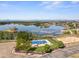 Aerial view showcasing a serene lake with a swimming pool, offering a picturesque escape at 12648 Waterside Ln, Longmont, CO 80504