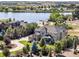 Scenic aerial view showcases the home's private location on the lake and lush surrounding landscape at 12648 Waterside Ln, Longmont, CO 80504