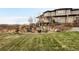 Scenic backyard with a cozy stone fire pit area, perfect for outdoor gatherings and enjoying nature at 12648 Waterside Ln, Longmont, CO 80504
