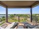 Enjoy the view from this balcony featuring outdoor seating and overlooking a scenic landscape at 12648 Waterside Ln, Longmont, CO 80504