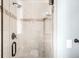 Modern bathroom featuring a glass shower with tile accents and sleek fixtures at 12648 Waterside Ln, Longmont, CO 80504
