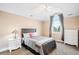 Bedroom featuring a ceiling fan and a window with outdoor views at 12648 Waterside Ln, Longmont, CO 80504