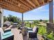 Outdoor deck furnished with patio furniture and a stunning lake view at 12648 Waterside Ln, Longmont, CO 80504