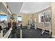 Home gym with various workout equipment, a mirror, and views of the outdoors at 12648 Waterside Ln, Longmont, CO 80504