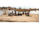 Scenic lakefront area with a charming fire pit and rustic seating, ideal for relaxation by the water at 12648 Waterside Ln, Longmont, CO 80504