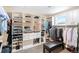 Spacious walk-in closet with built-in shelving and drawers for optimal organization at 12648 Waterside Ln, Longmont, CO 80504