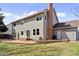 Charming backyard with brick patio and lush green lawn at 7470 S Steele Cir, Centennial, CO 80122