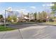 Community basketball court with hoops at each end and trees around perimeter for recreation at 7470 S Steele Cir, Centennial, CO 80122