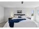Bright bedroom featuring neutral walls, ceiling fan, and decor at 7470 S Steele Cir, Centennial, CO 80122