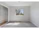 Bright bedroom featuring a neutral paint, carpet, and a window with backyard views at 7470 S Steele Cir, Centennial, CO 80122