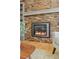 Close-up of a modern fireplace with a stone surround and contemporary design, radiating warmth and style at 7470 S Steele Cir, Centennial, CO 80122