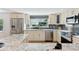Well-equipped kitchen featuring granite countertops, stainless steel appliances, and stylish backsplash details at 7470 S Steele Cir, Centennial, CO 80122