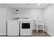 Laundry room with side-by-side washer and dryer and utility sink at 7470 S Steele Cir, Centennial, CO 80122