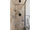 Tile shower featuring a glass door, mosaic accents and a shower head at 7470 S Steele Cir, Centennial, CO 80122