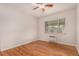 Bright bedroom with hardwood floors, natural light, and minimal furnishings at 1454 Jersey St # 104, Denver, CO 80220