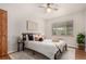 Comfortable bedroom featuring neutral walls, ceiling fan, and lots of natural light at 1454 Jersey St # 104, Denver, CO 80220