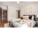 Well-lit bedroom with wood floors and minimalist decor, creating a calm atmosphere at 1454 Jersey St # 104, Denver, CO 80220