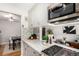 Contemporary kitchen with white cabinets, stainless steel appliances, and stylish backsplash at 1454 Jersey St # 104, Denver, CO 80220