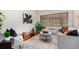 Cozy living room with neutral tones, comfortable seating, and ample natural light at 1454 Jersey St # 104, Denver, CO 80220
