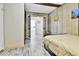 Bedroom featuring wood-look floors, warm tones, and doorway at 2171 S Cherokee St, Denver, CO 80223
