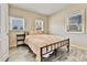 Bedroom showcasing wood-look floors and two windows that let in natural light at 2171 S Cherokee St, Denver, CO 80223